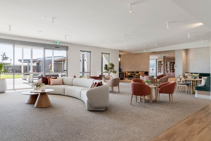 Modern lounge with curved sofa and armchairs