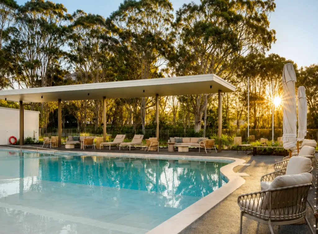 Modern poolside lounge area at sunset