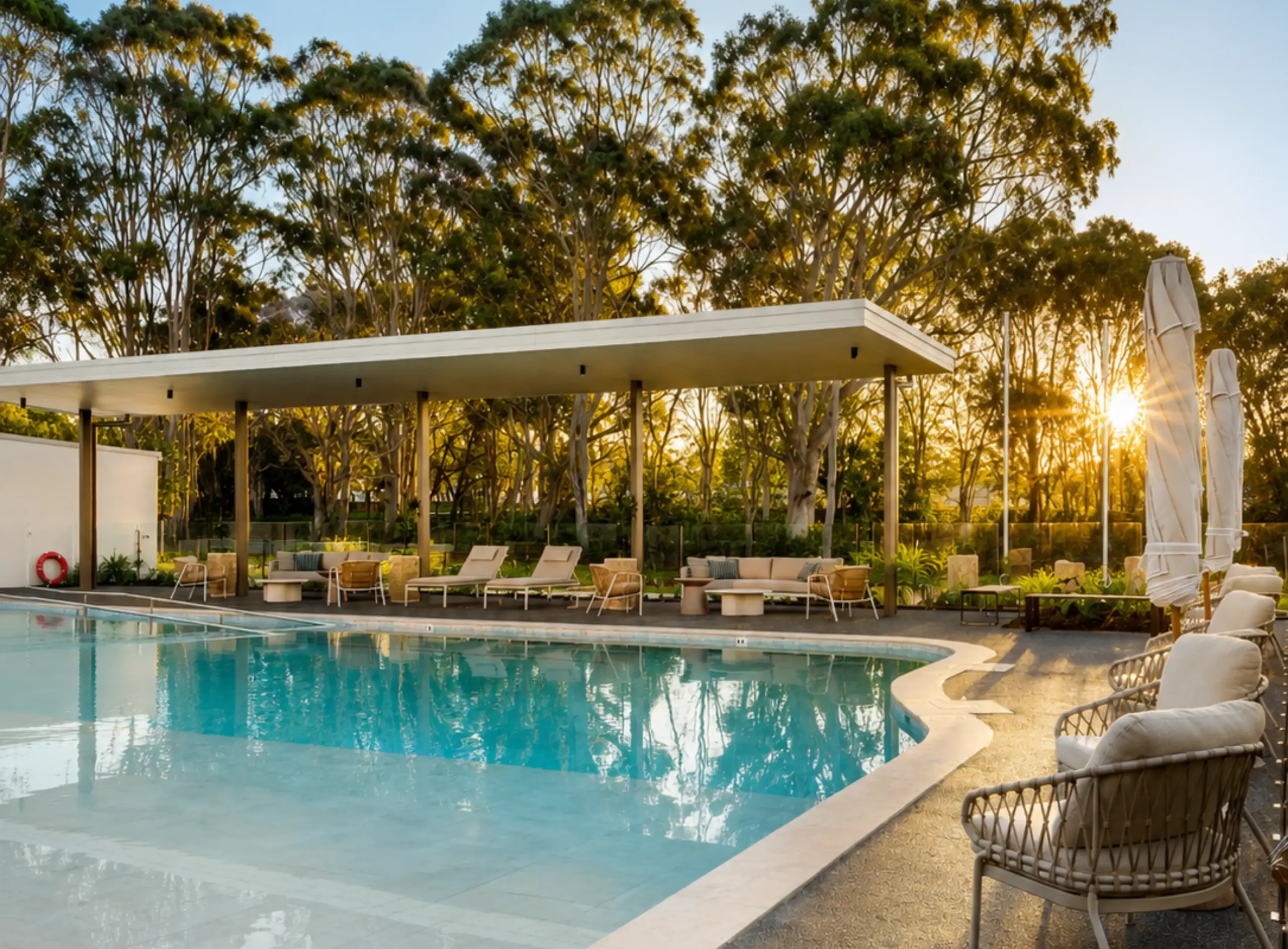Modern poolside lounge area at sunset