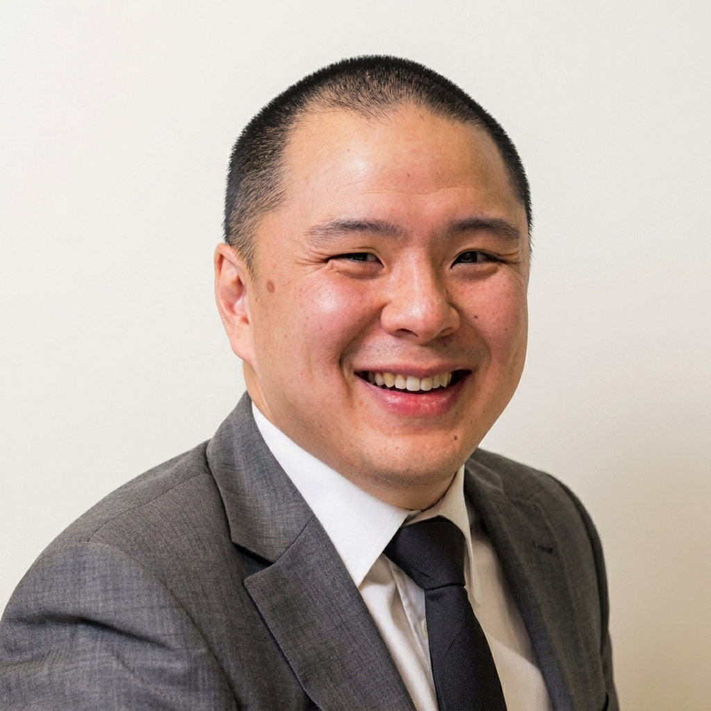 Smiling man in grey suit and tie