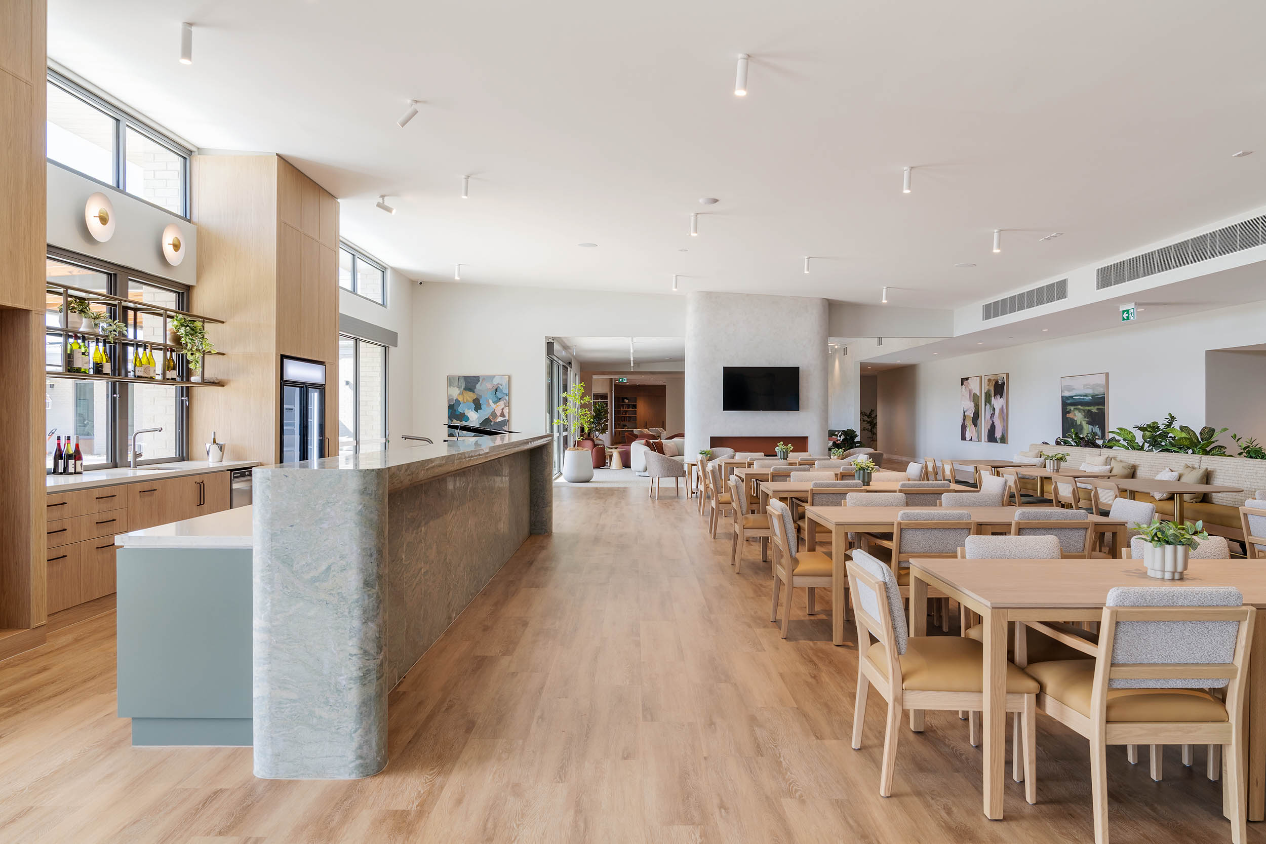 Modern light-filled dining area with timber furnishings
