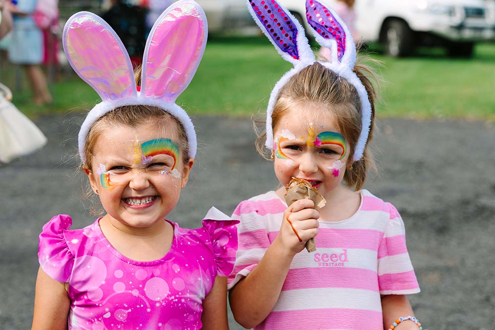 Two girls with bunny ears and face paint