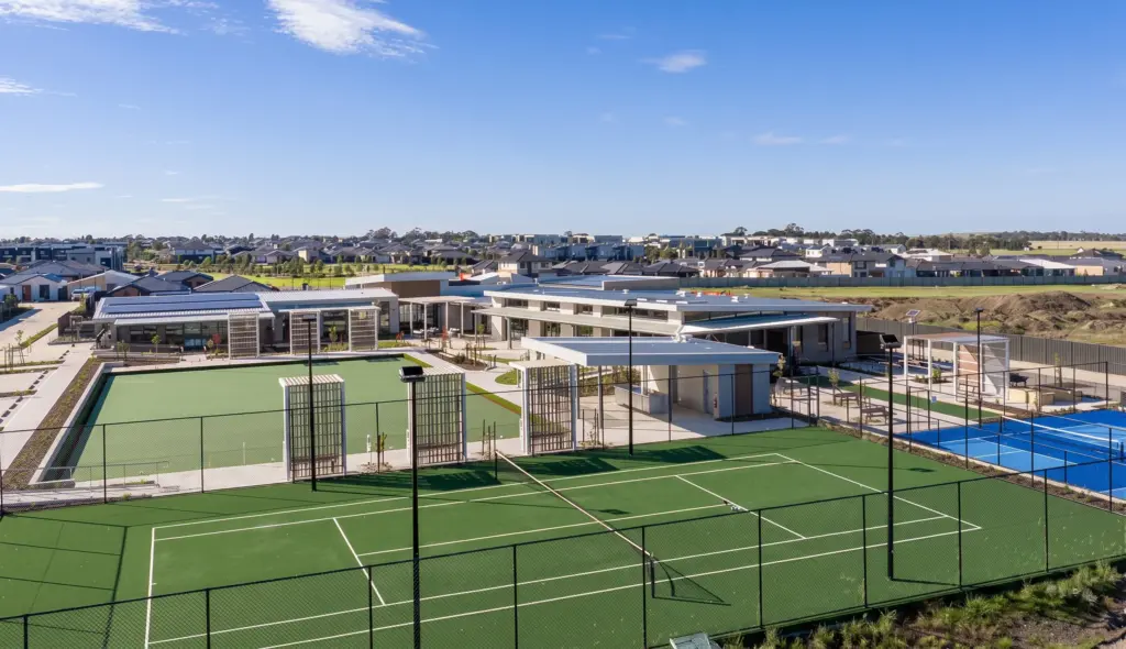 Modern residential complex with tennis courts and clubhouse