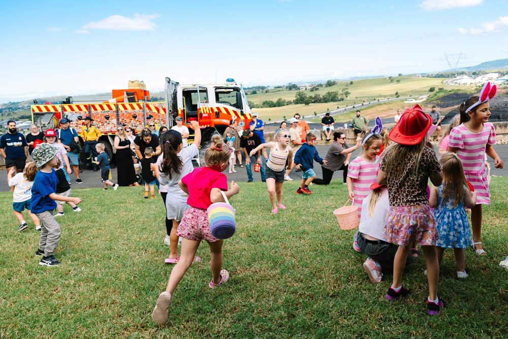 Children at Easter egg hunt near fire truck