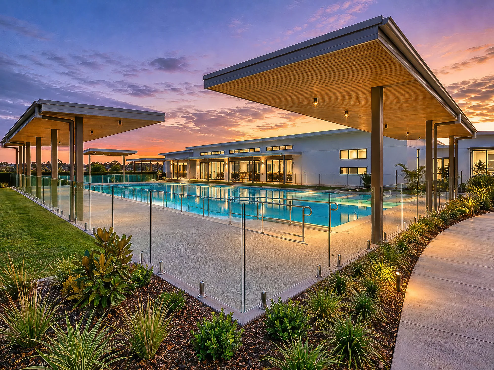 Modern outdoor swimming pool at sunset
