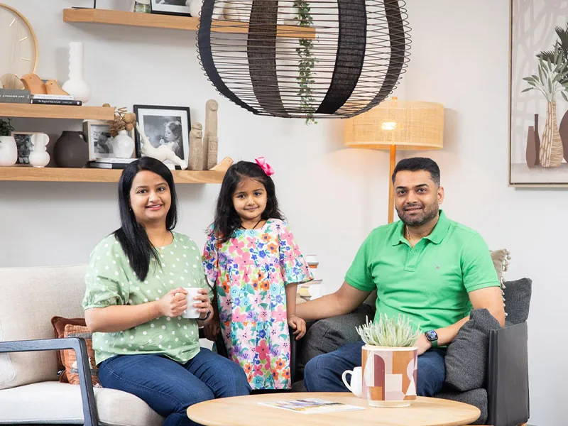 Family of three in modern living room
